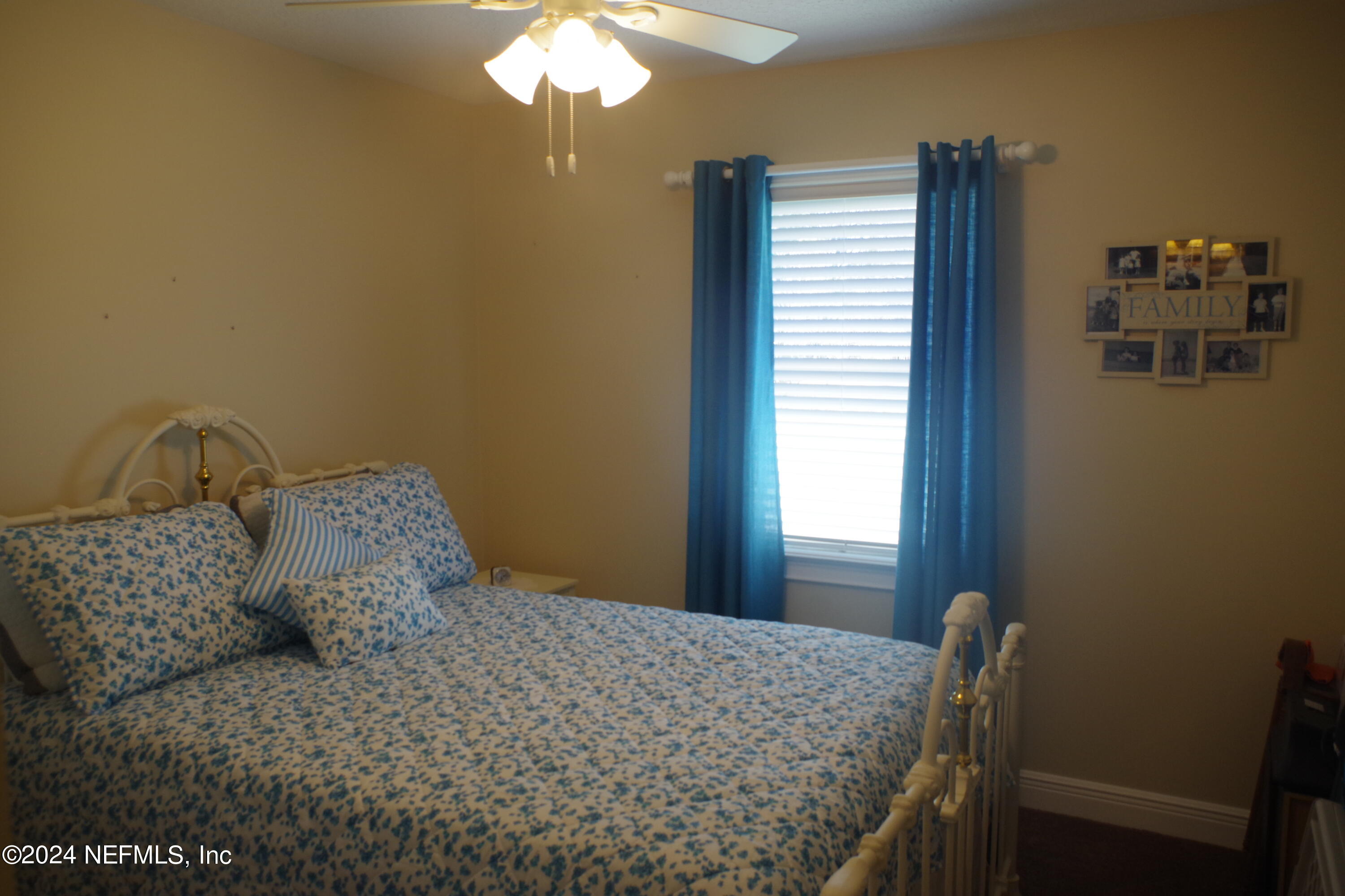 54065 Howard Road Callahan, FL 32011 - Photo 37 of 69 a bedroom with a bed and a window