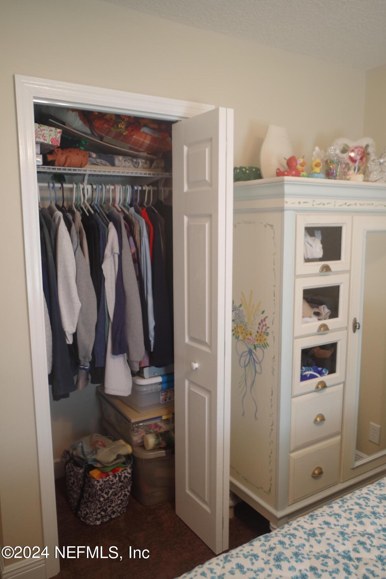 54065 Howard Road Callahan, FL 32011 - Photo 39 of 69 a view of walk in closet with clothes and shoes