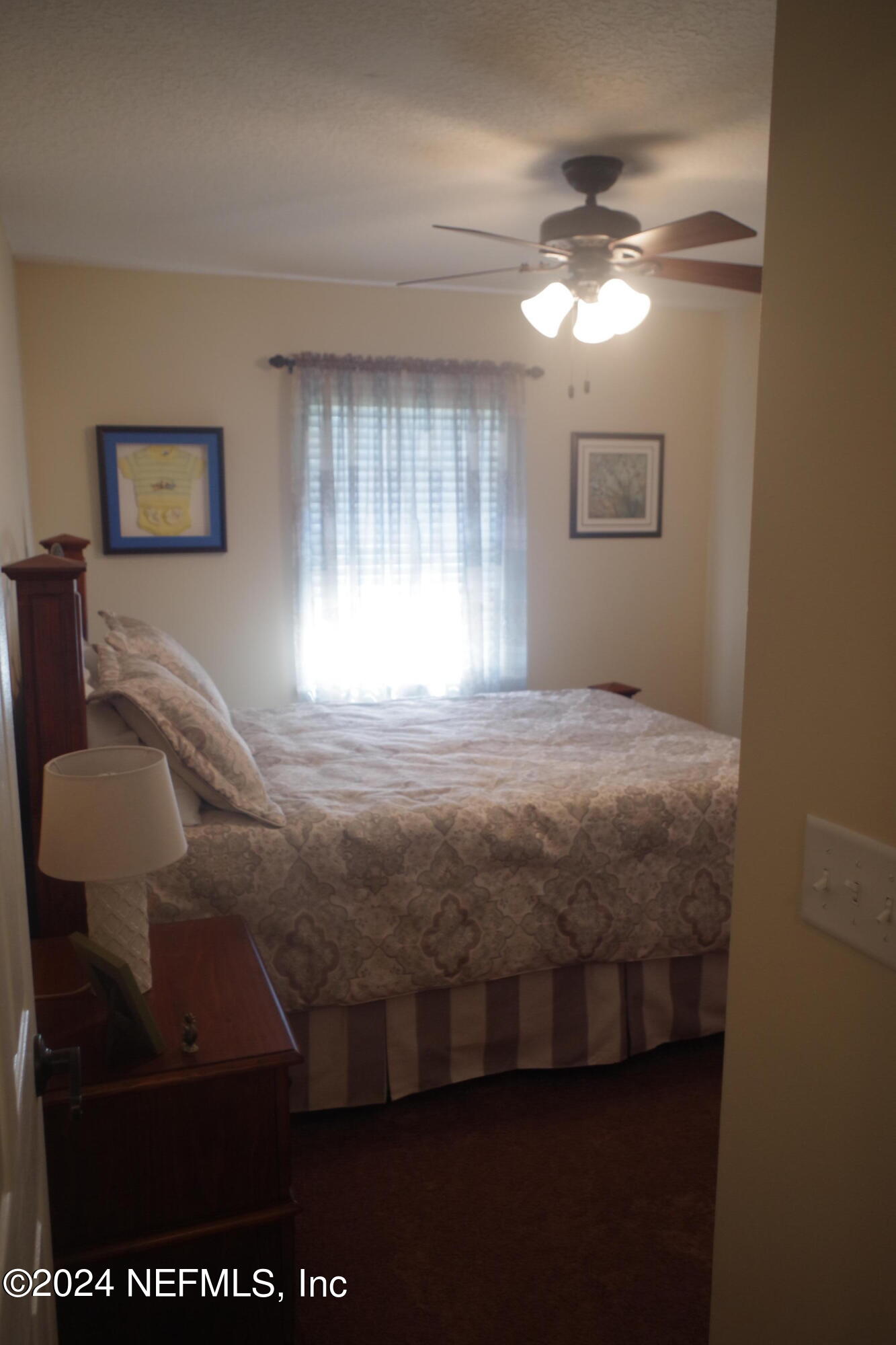 54065 Howard Road Callahan, FL 32011 - Photo 40 of 69 a bedroom with a bed and a window