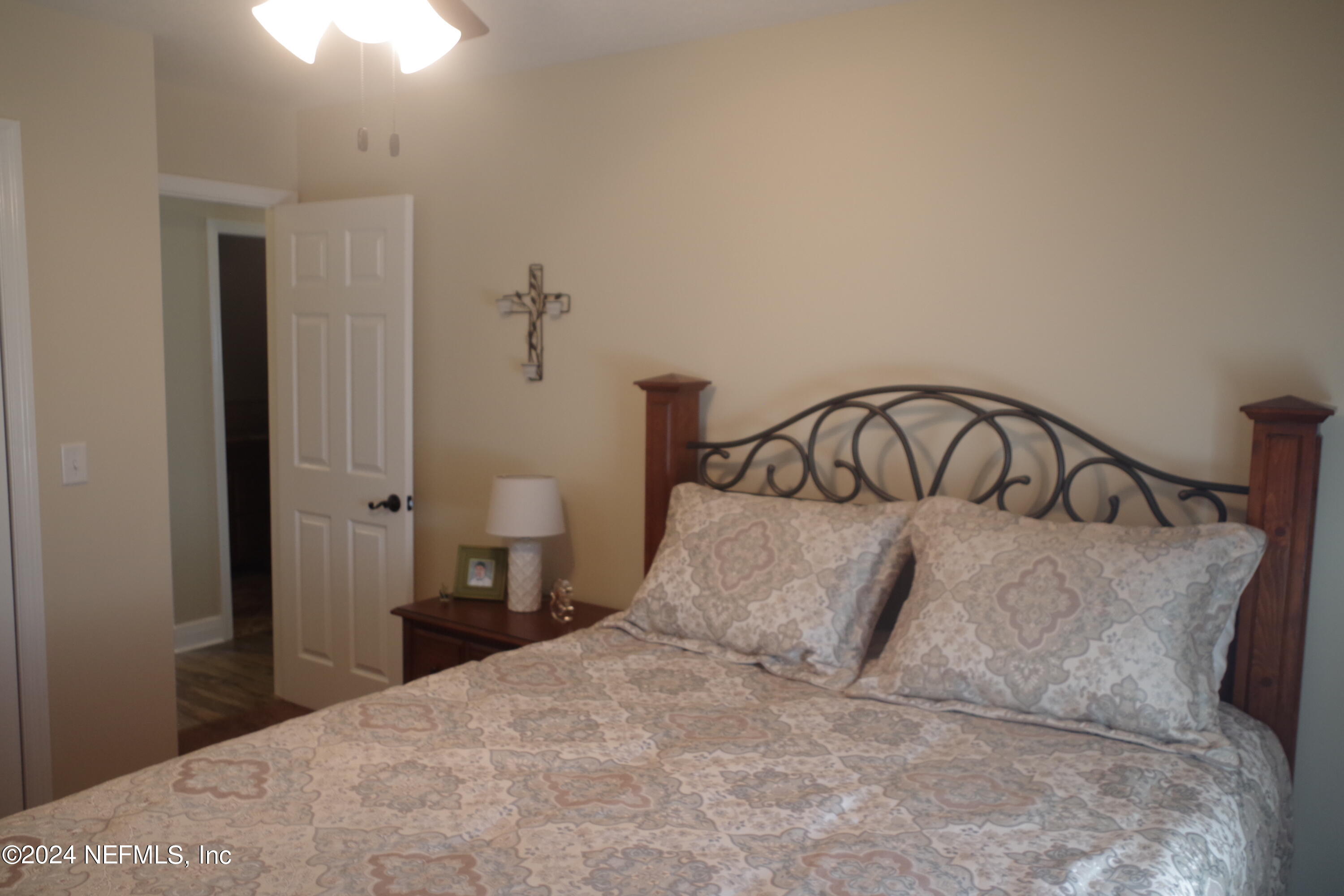 54065 Howard Road Callahan, FL 32011 - Photo 42 of 69 a bedroom with a bed and a table