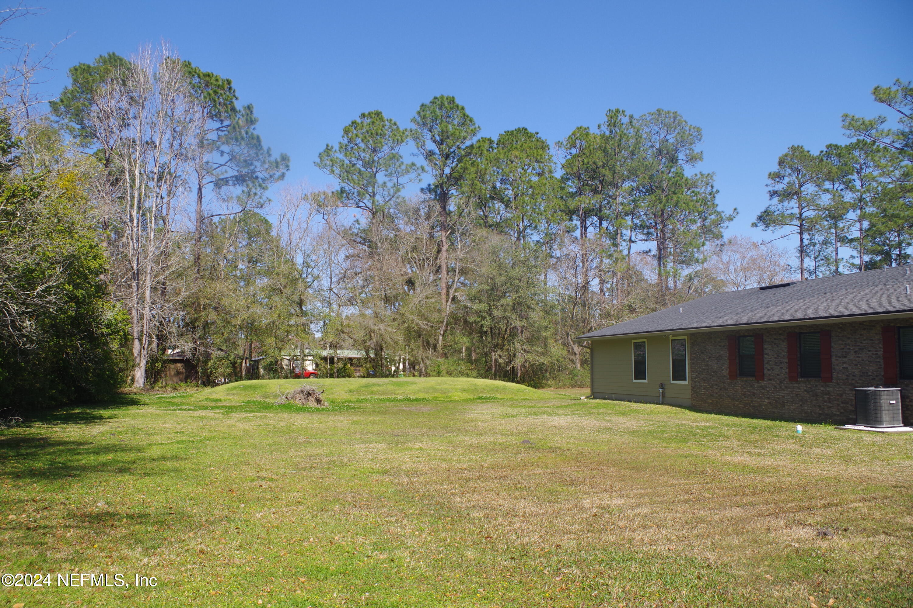 54065 Howard Road Callahan, FL 32011 - Photo 60 of 69 a front view of house with yard and trees