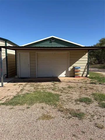 a front view of a house with garage
