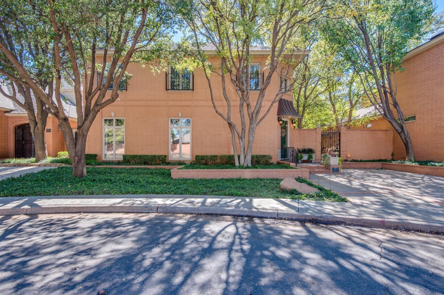4407 7th Street Lubbock, TX 79416 - Photo 2 of 10 a view of a park with large trees