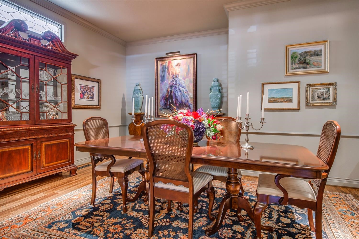 4407 7th Street Lubbock, TX 79416 - Photo 9 of 10 a view of a dining room with furniture and chandelier