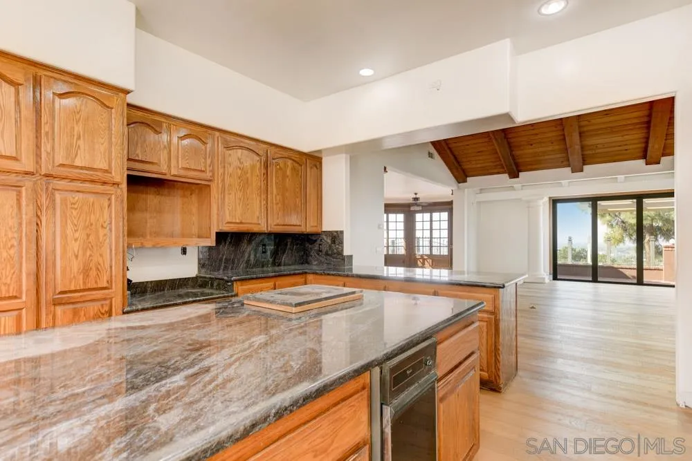 1762 Kings Road Vista, CA 92084 - Photo 14 of 24 a kitchen with a sink a stove and cabinets