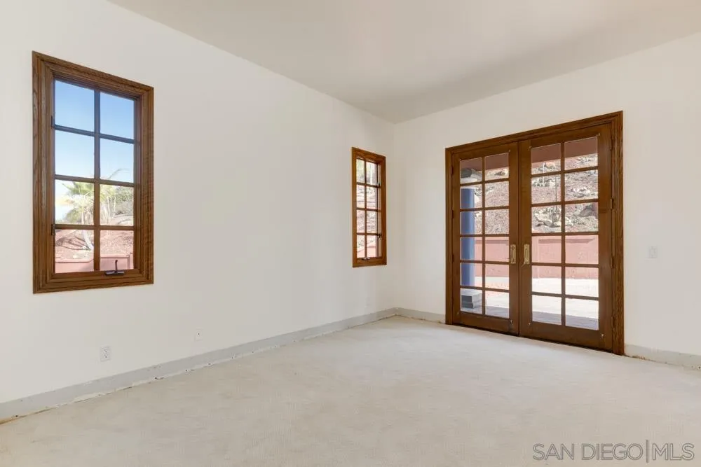 1762 Kings Road Vista, CA 92084 - Photo 18 of 24 an empty room with windows and closet
