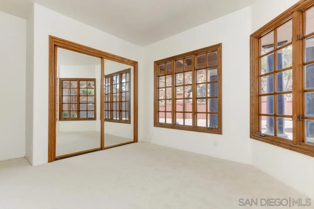 1762 Kings Road Vista, CA 92084 - Photo 19 of 24 a view of an empty room with a large window