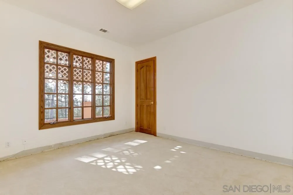 1762 Kings Road Vista, CA 92084 - Photo 20 of 24 an empty room with windows