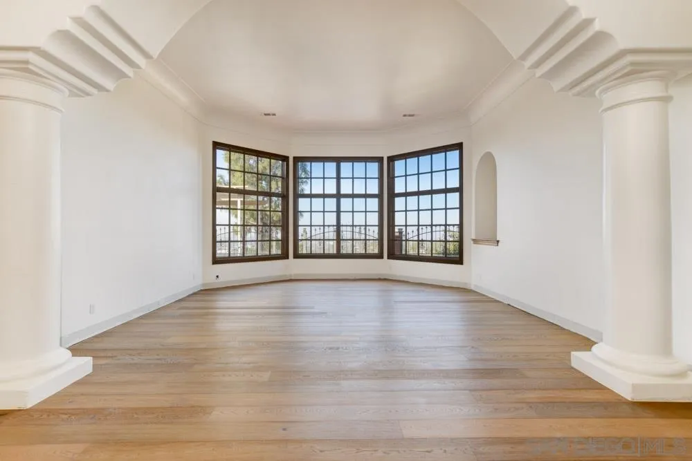1762 Kings Road Vista, CA 92084 - Photo 5 of 24 wooden floor in an empty room with a window