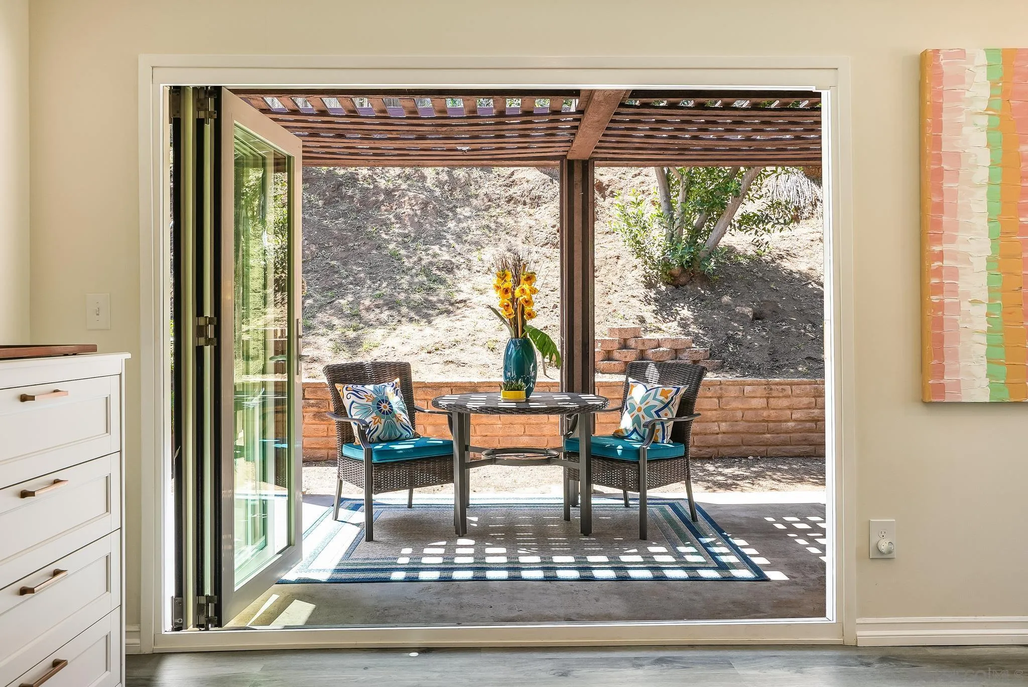 2211 Sunset Drive Escondido, CA 92025 - Photo 14 of 43 a living room with a table and a floor to ceiling window