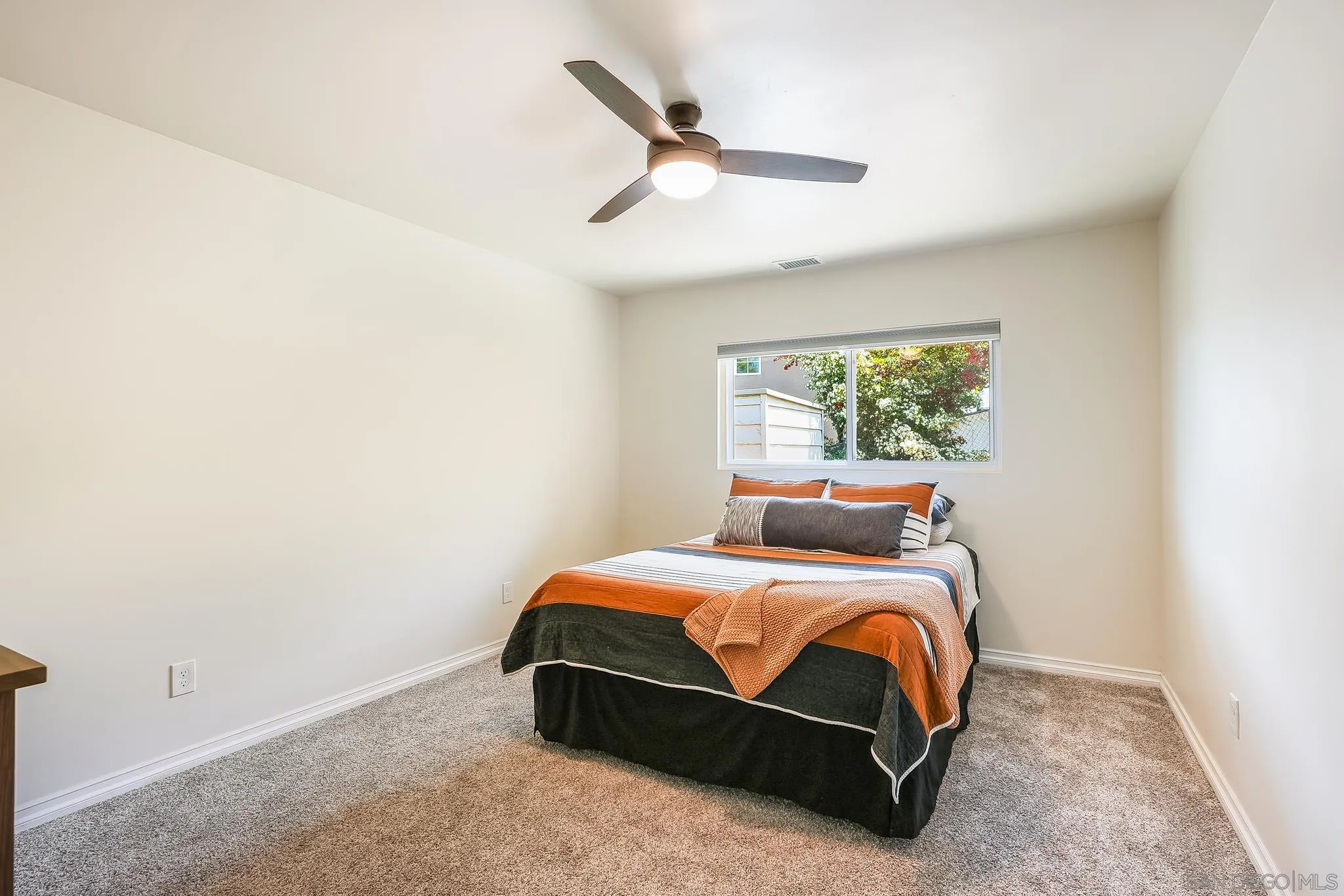 2211 Sunset Drive Escondido, CA 92025 - Photo 25 of 43 a bedroom with a bed and a window