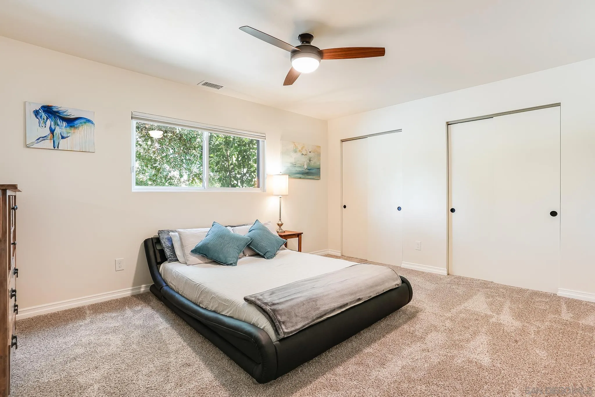 2211 Sunset Drive Escondido, CA 92025 - Photo 27 of 43 a bedroom with a bed and a painting on the wall