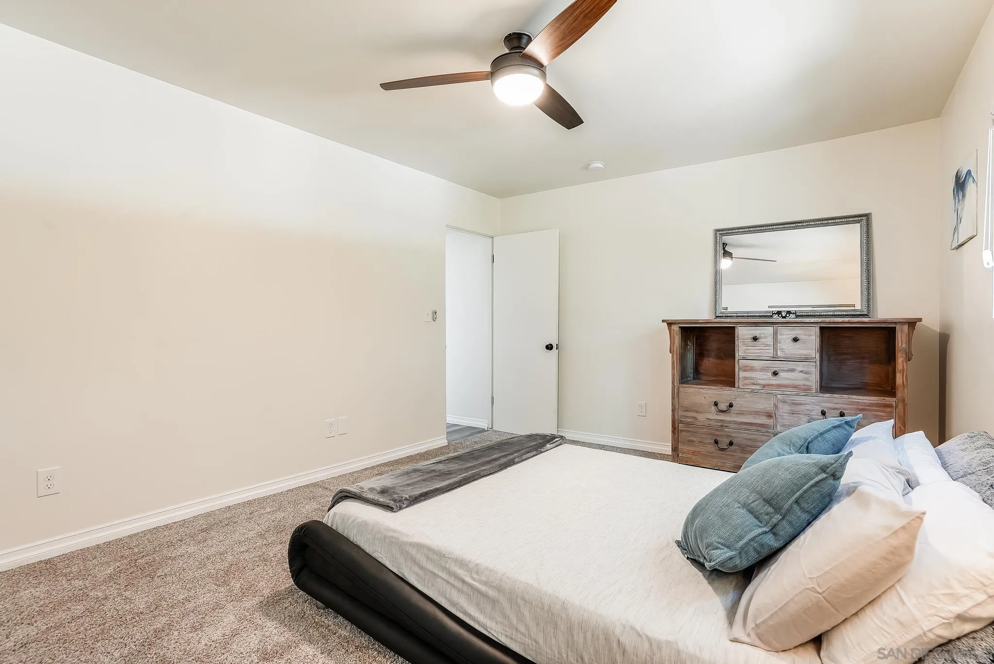 2211 Sunset Drive Escondido, CA 92025 - Photo 28 of 43 a bedroom with a bed and a flat screen tv