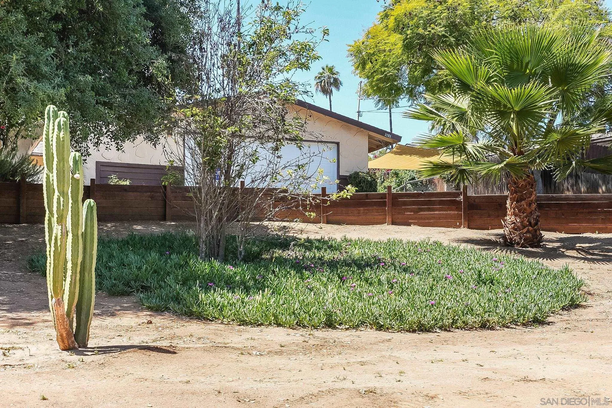 2211 Sunset Drive Escondido, CA 92025 - Photo 32 of 43 a front view of a house with a yard