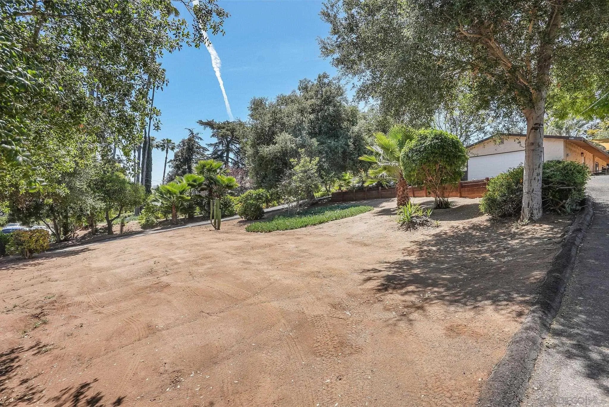 2211 Sunset Drive Escondido, CA 92025 - Photo 34 of 43 a view of a road with plants and trees