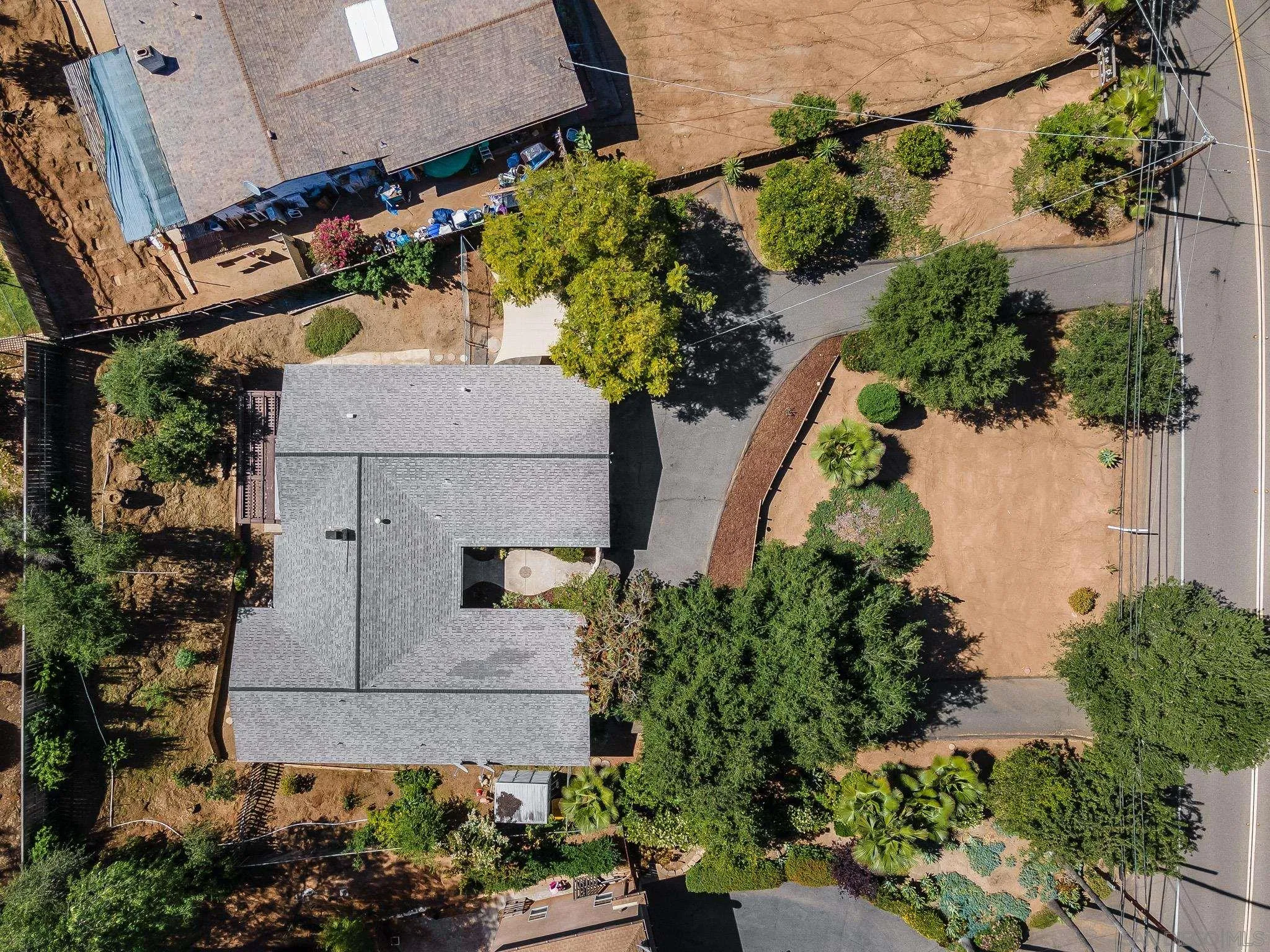 2211 Sunset Drive Escondido, CA 92025 - Photo 42 of 43 an aerial view of a house with a yard and garden