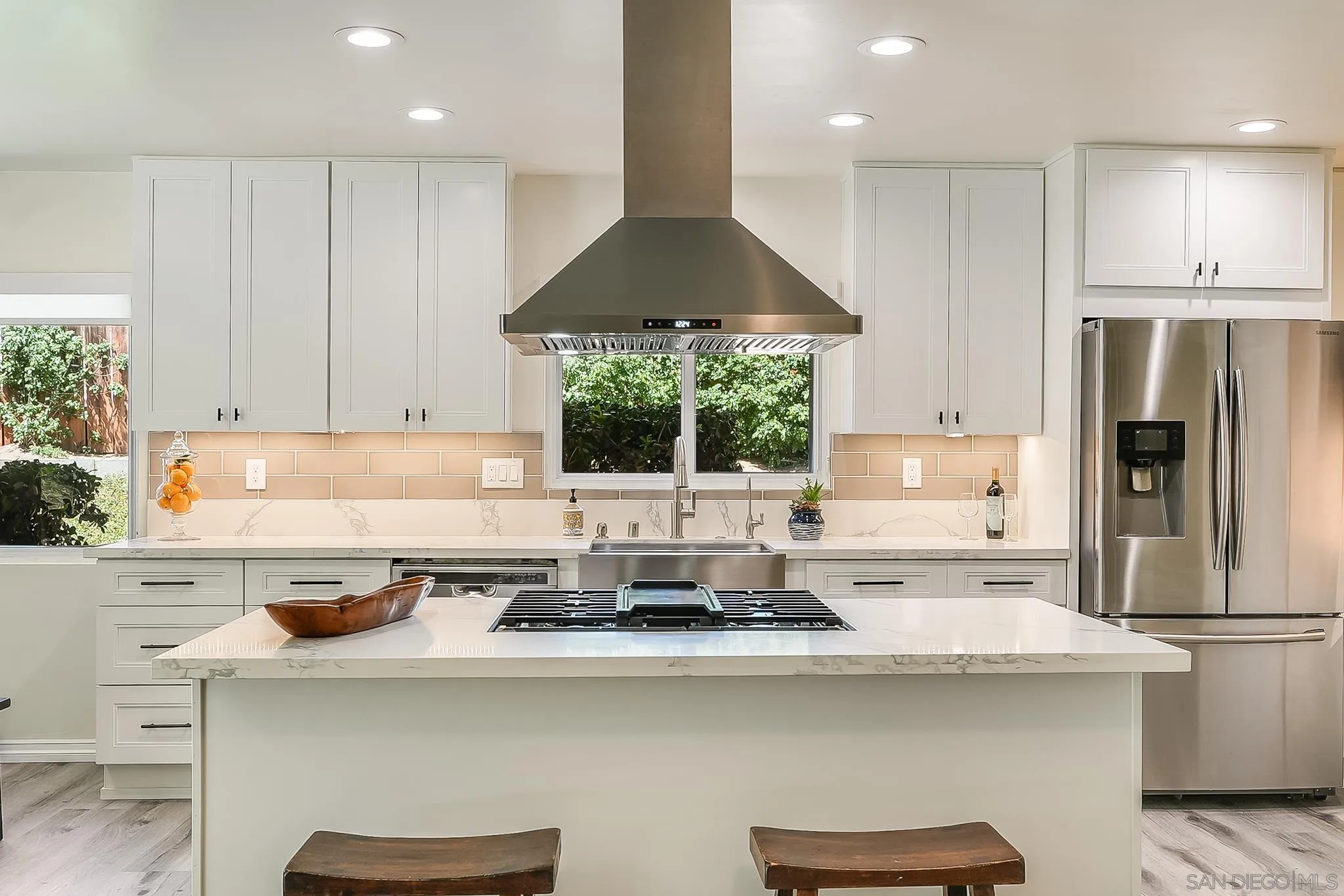 2211 Sunset Drive Escondido, CA 92025 - Photo 5 of 43 a kitchen with a stove a refrigerator and cabinets