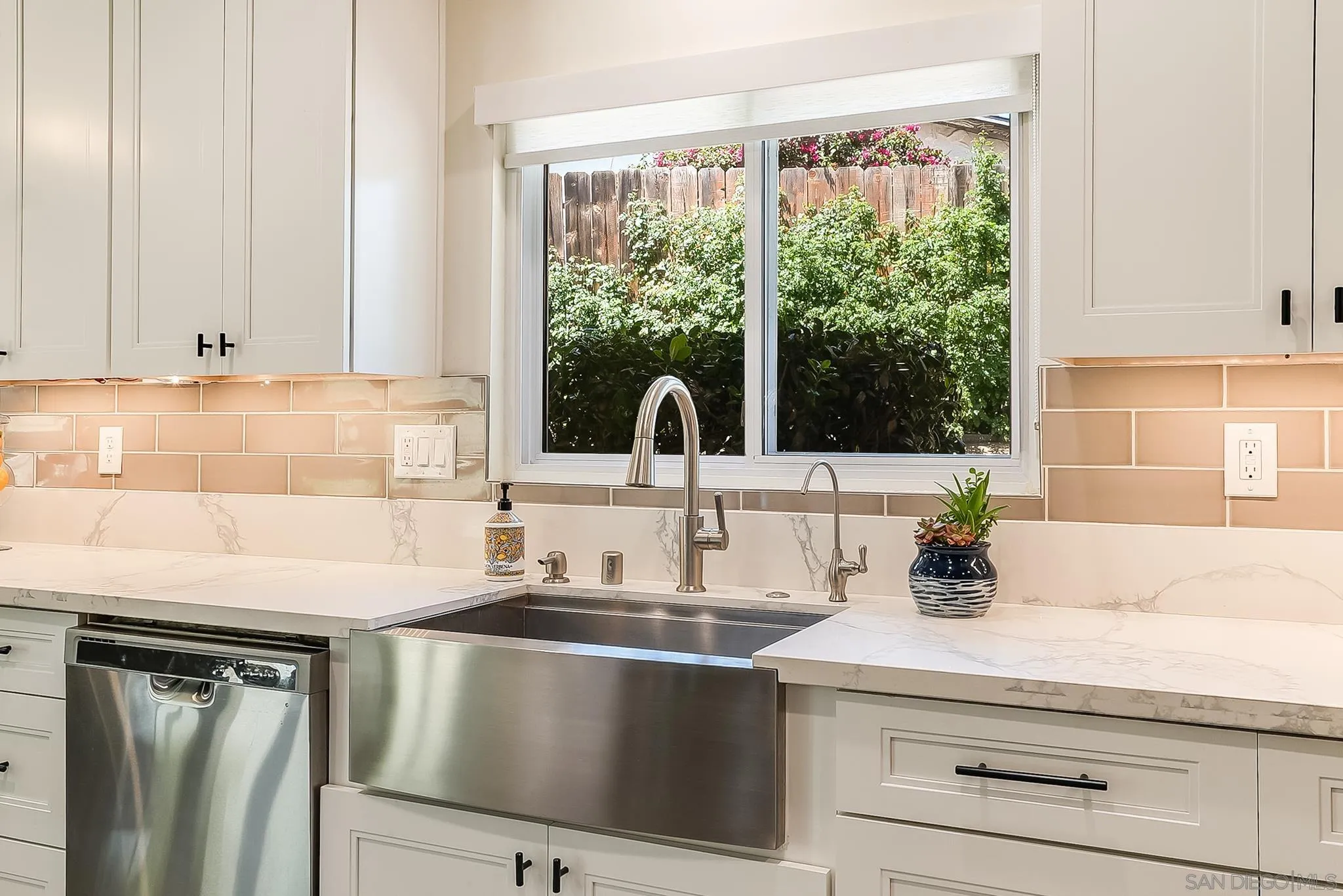 2211 Sunset Drive Escondido, CA 92025 - Photo 7 of 43 a kitchen with a sink and large window