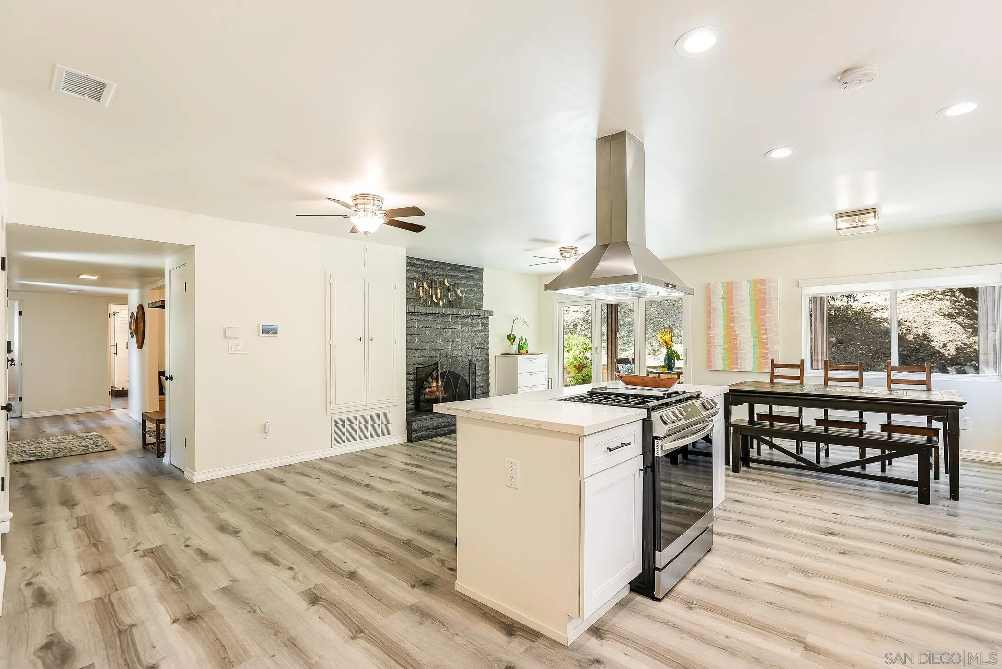 2211 Sunset Drive Escondido, CA 92025 - Photo 9 of 43 a kitchen with a stove and a wooden floors