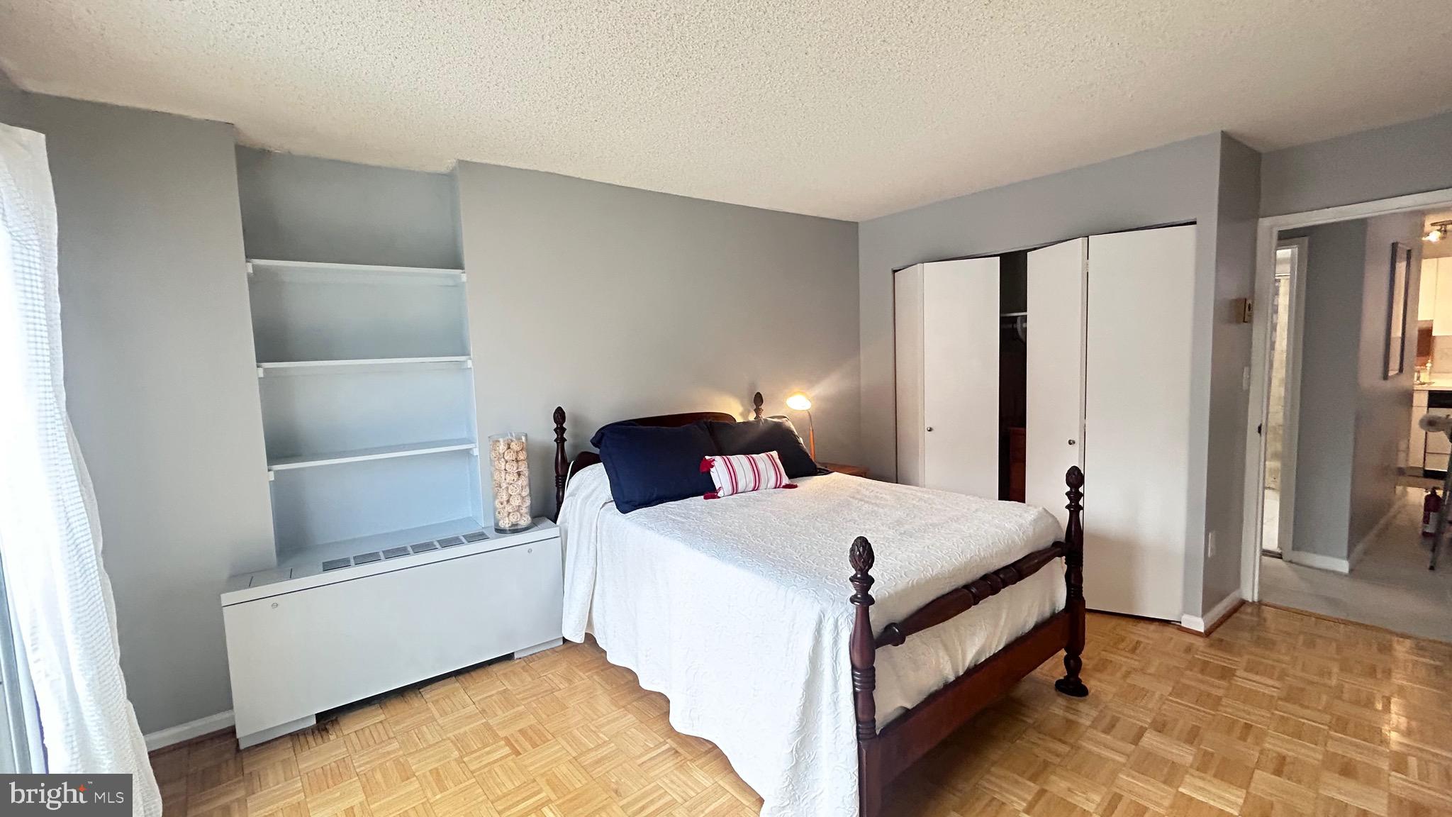 1239 Vermont Avenue Northwest, Unit 204 Washington, DC 20005 - Photo 17 of 39 a bed room with a bed and a window
