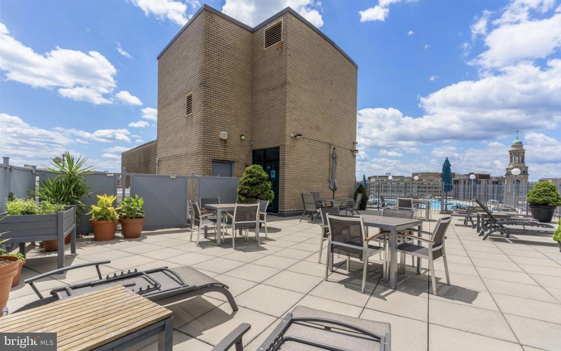 1239 Vermont Avenue Northwest, Unit 204 Washington, DC 20005 - Photo 25 of 39 a view of terrace with seating area and barbeque oven