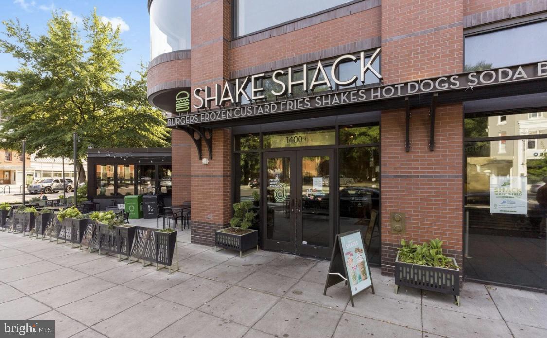 1239 Vermont Avenue Northwest, Unit 204 Washington, DC 20005 - Photo 36 of 39 a view of a cafe with sitting area