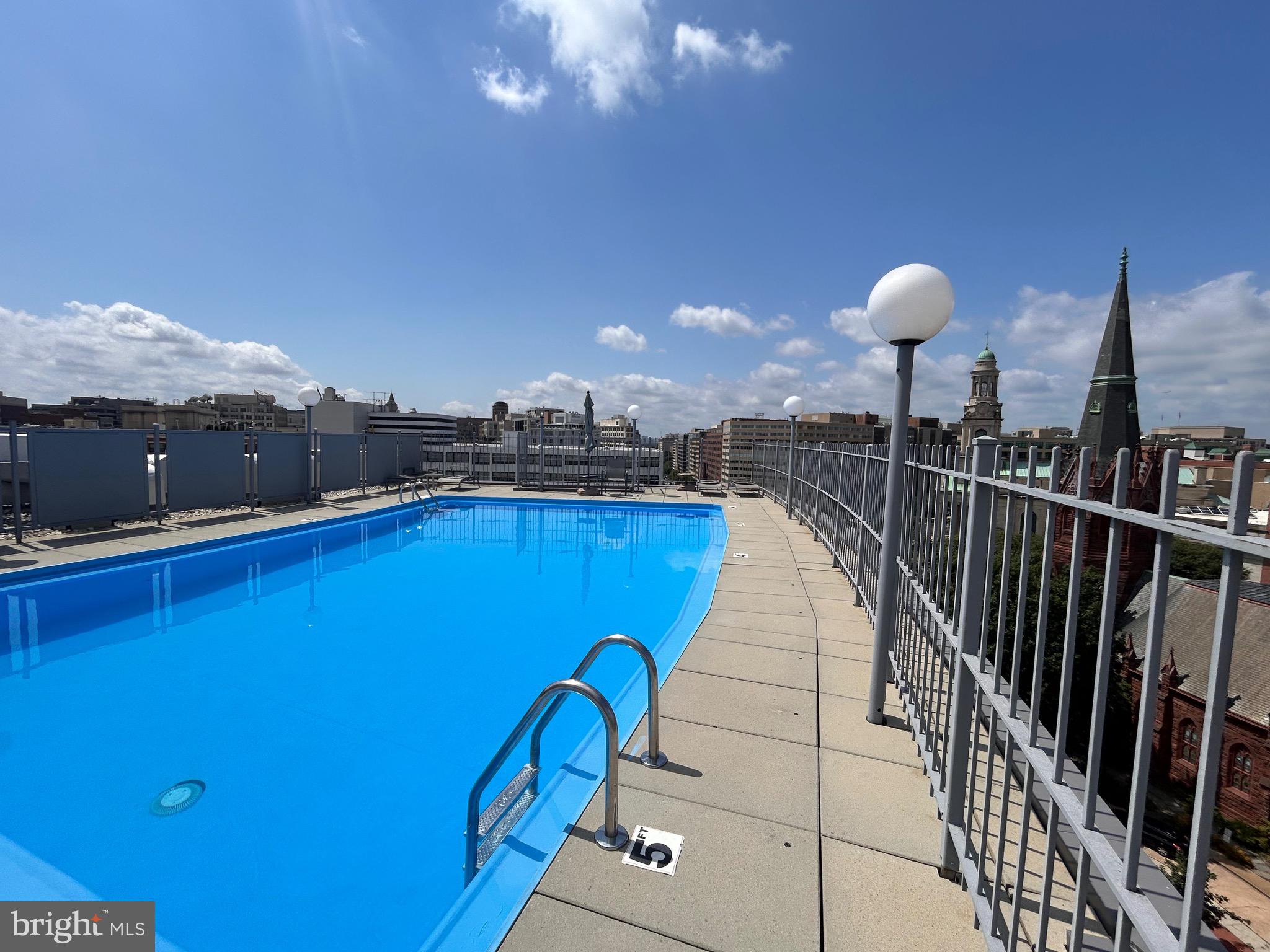 1239 Vermont Avenue Northwest, Unit 204 Washington, DC 20005 - Photo 38 of 39 a dinning table and chairs in a terrace