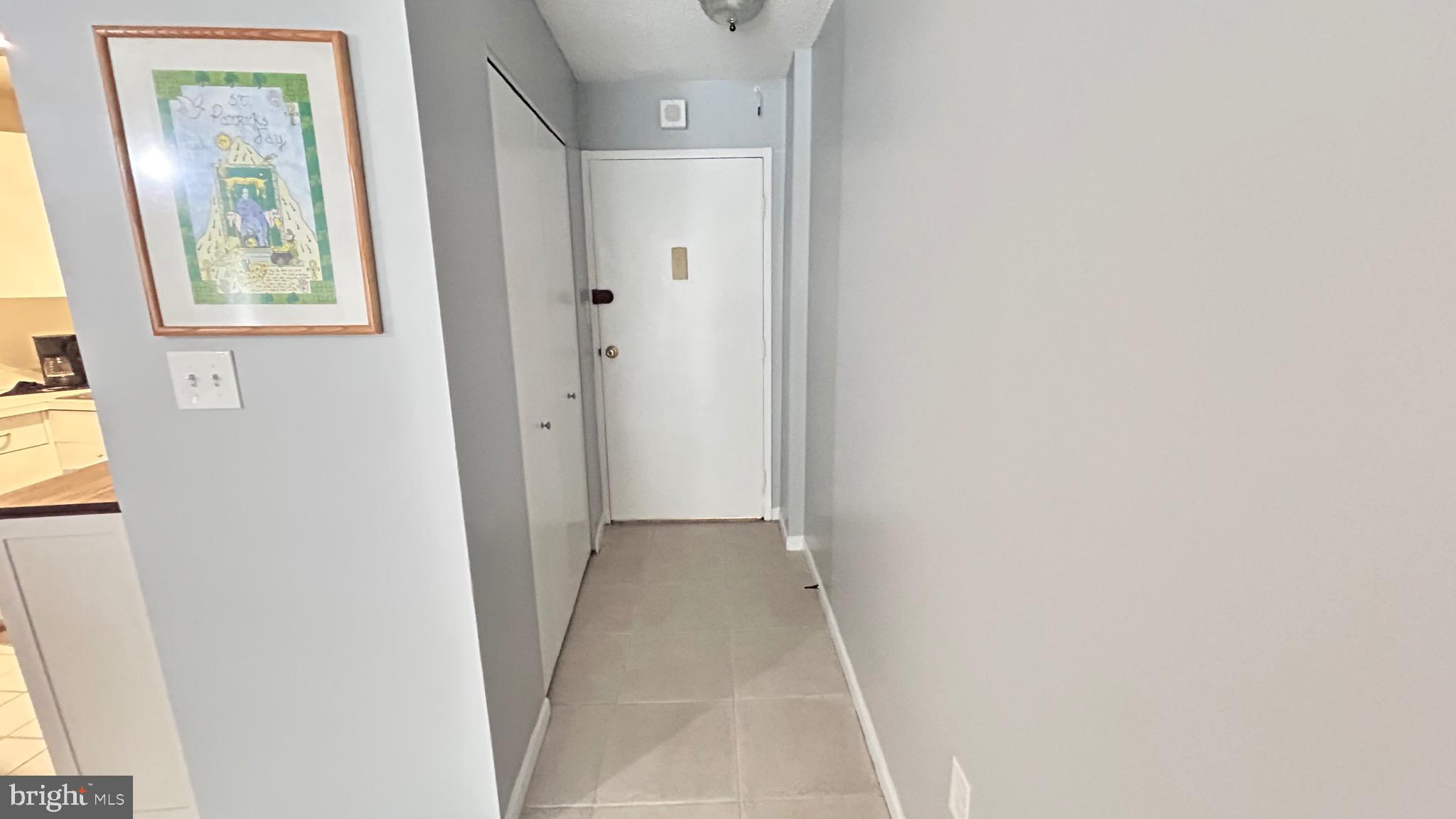 1239 Vermont Avenue Northwest, Unit 204 Washington, DC 20005 - Photo 4 of 39 a view of a hallway with closet and bathroom