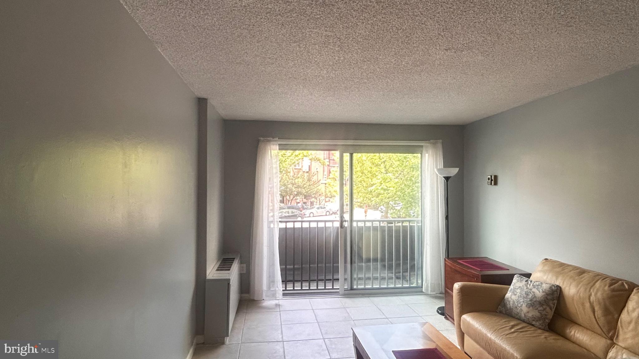 1239 Vermont Avenue Northwest, Unit 204 Washington, DC 20005 - Photo 5 of 43 Bright and airy living space awaits.