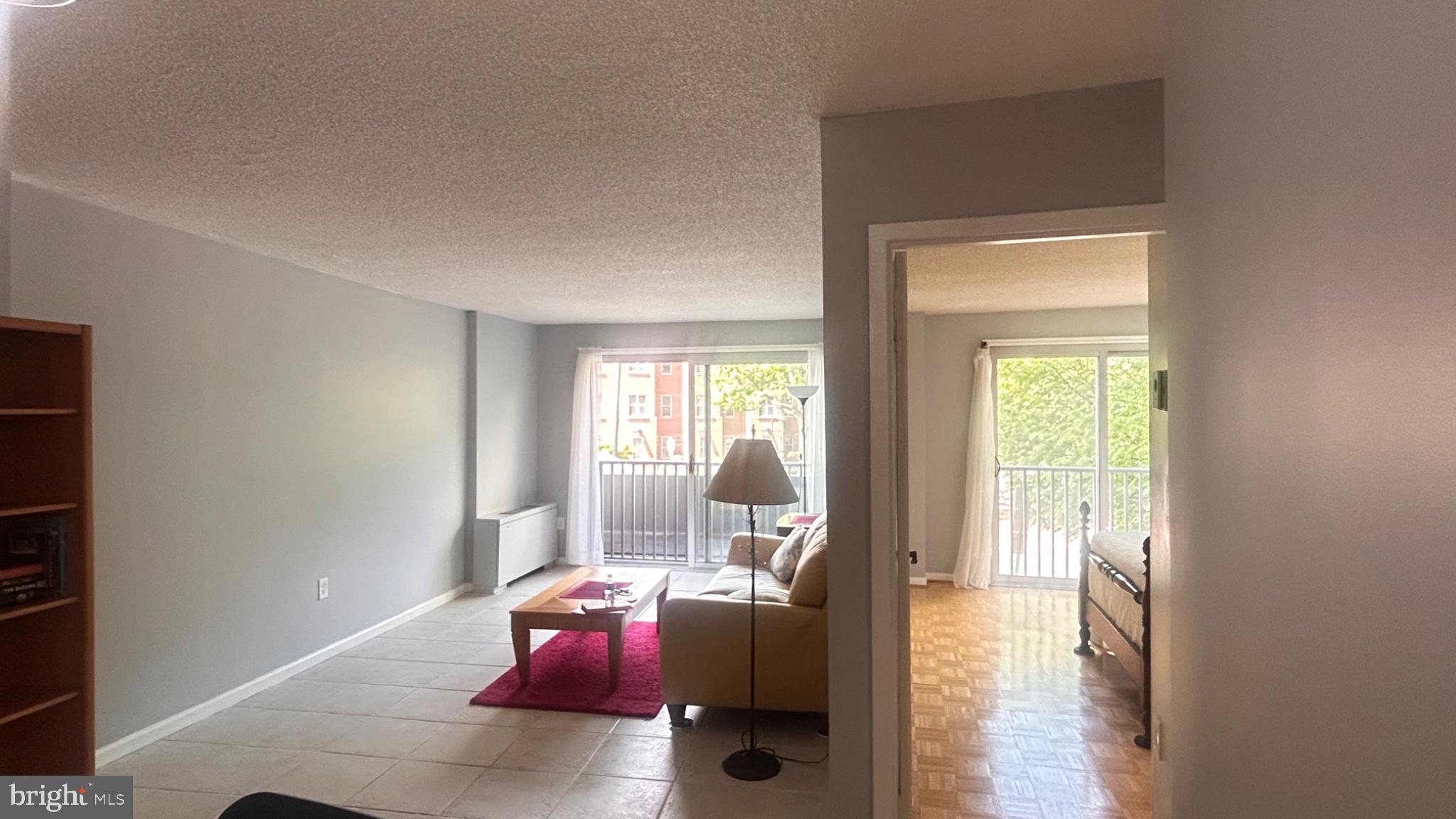 1239 Vermont Avenue Northwest, Unit 204 Washington, DC 20005 - Photo 10 of 43 Bright and airy open living space.
