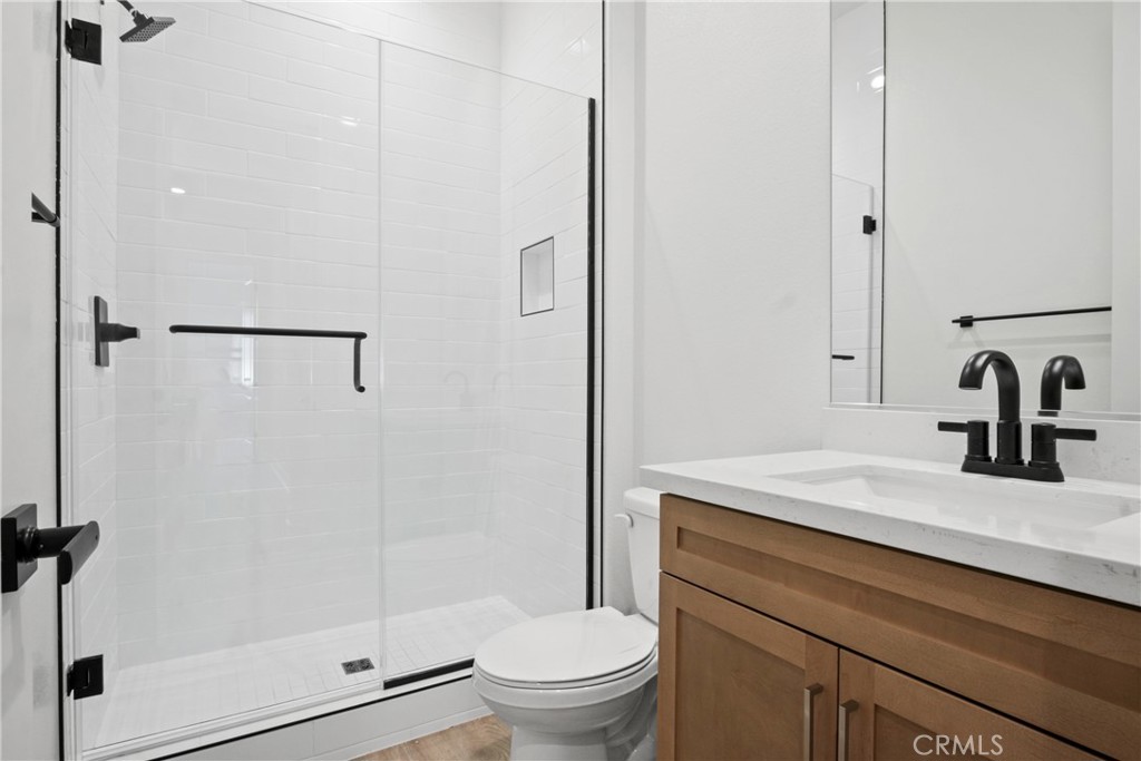 4685 Avondale Court Chino, CA 91710 - Photo 11 of 16 a bathroom with a sink toilet and shower