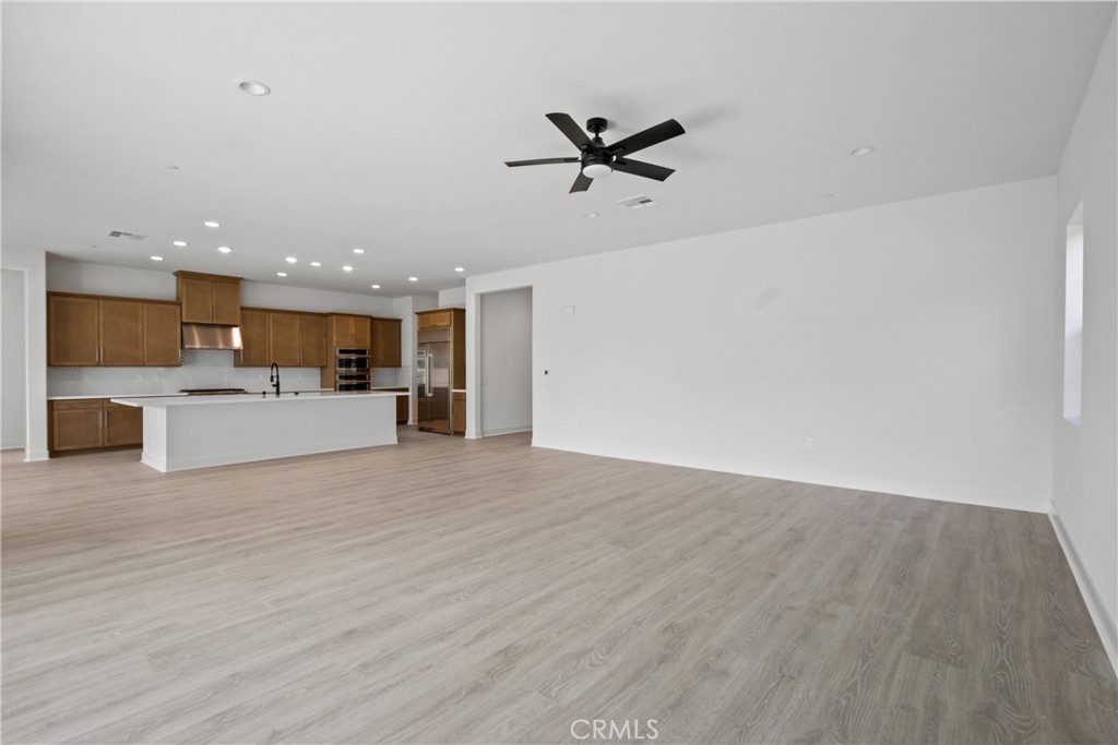4685 Avondale Court Chino, CA 91710 - Photo 3 of 16 a view of a kitchen with a sink and a refrigerator