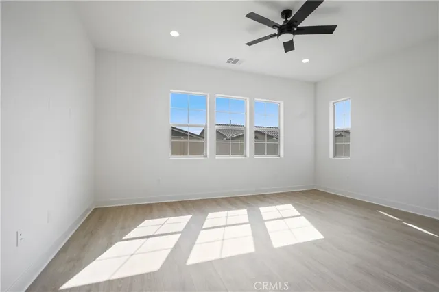 a bathroom with a double vanity sink a large mirror and a bathtub