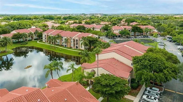 an aerial view of a house with a lake view