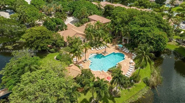 a backyard of a house with a yard and outdoor seating
