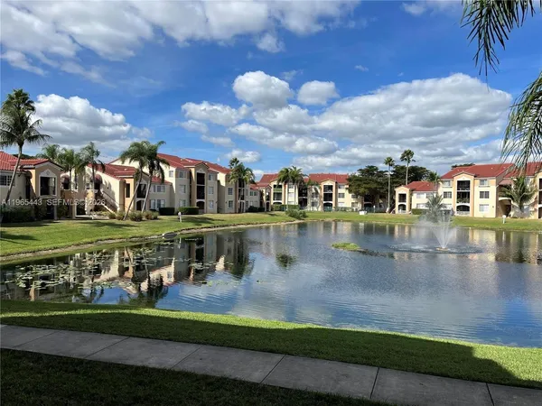 a view of a lake with a building in the background