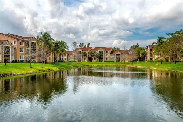 a view of residential house with outdoor space and lake