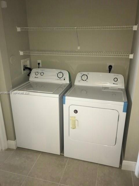 2031 Renaissance Boulevard, Unit 106 Miramar, FL 33025 - Photo 19 of 19 a utility room with dryer and washer