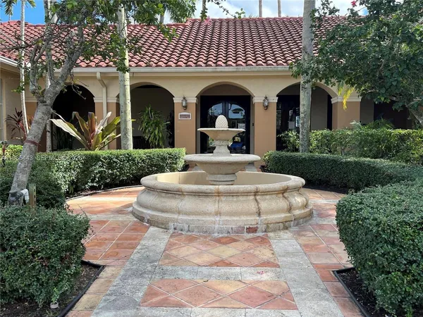 a view of a white house with a yard