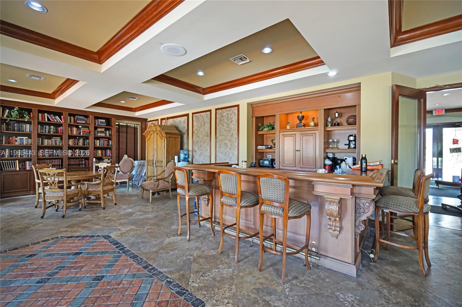 2031 Renaissance Boulevard, Unit 106 Miramar, FL 33025 - Photo 9 of 19 a view of a dining room with furniture window and outside view