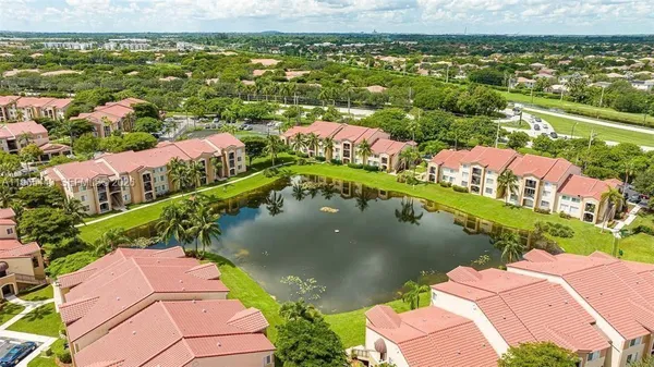 an aerial view of residential houses with outdoor space