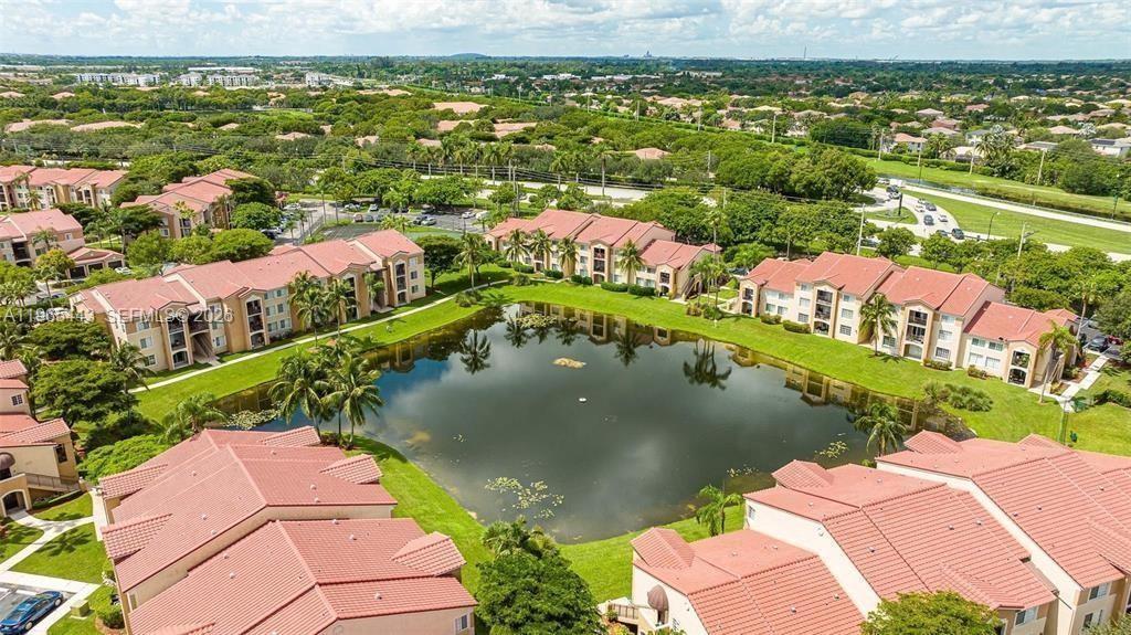 2031 Renaissance Boulevard, Unit 106 Miramar, FL 33025 - Photo 10 of 19 an aerial view of residential houses with outdoor space