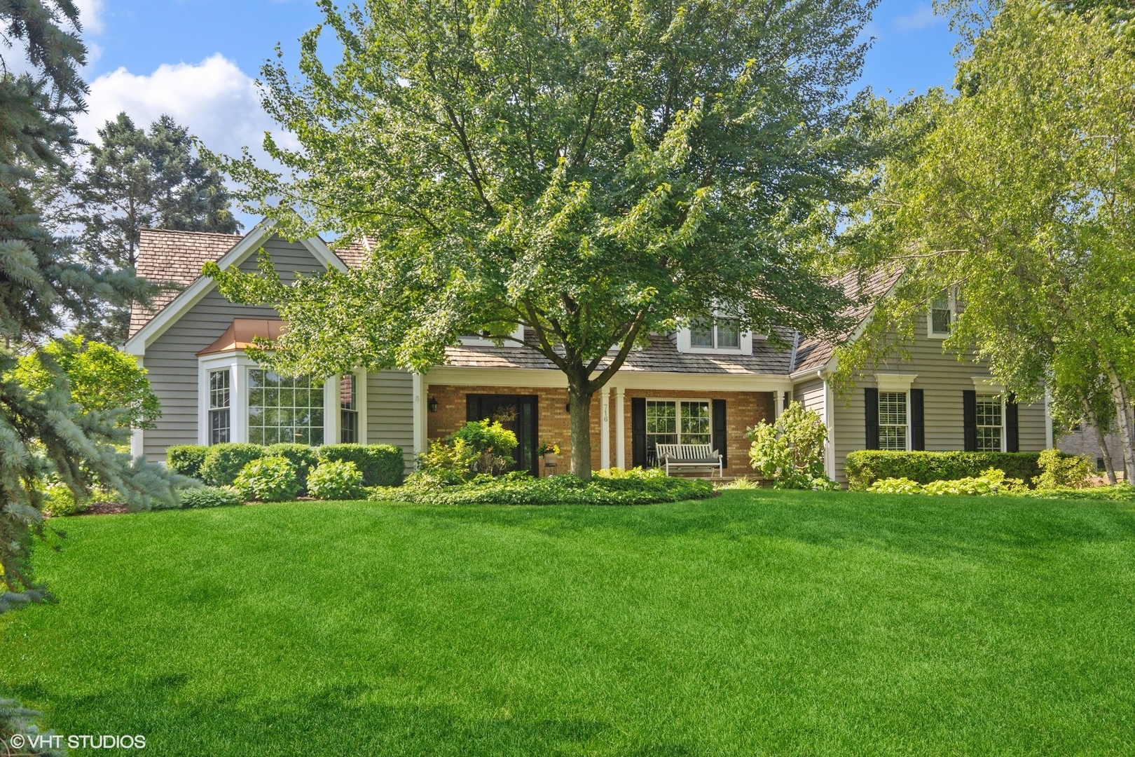 716 Saddle Ridge Crystal Lake, IL 60012 - Photo 1 of 42 a front view of house with yard and green space
