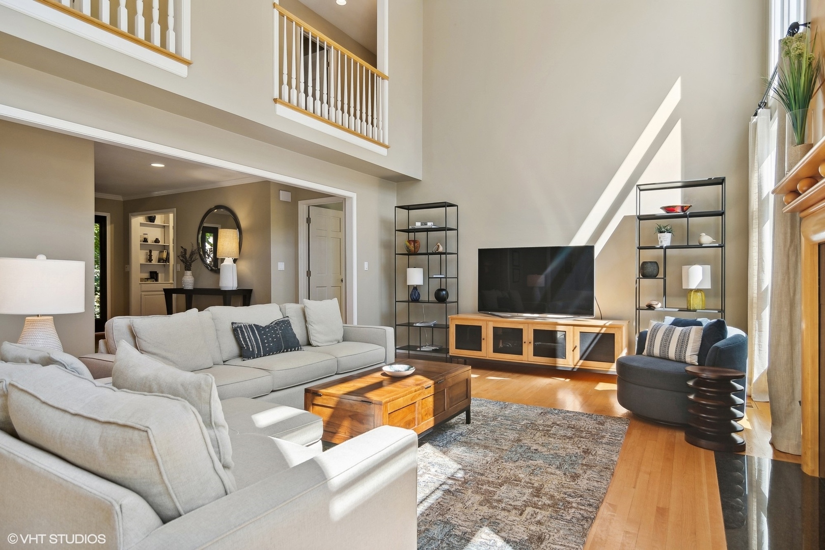 716 Saddle Ridge Crystal Lake, IL 60012 - Photo 12 of 42 a living room with furniture and a flat screen tv