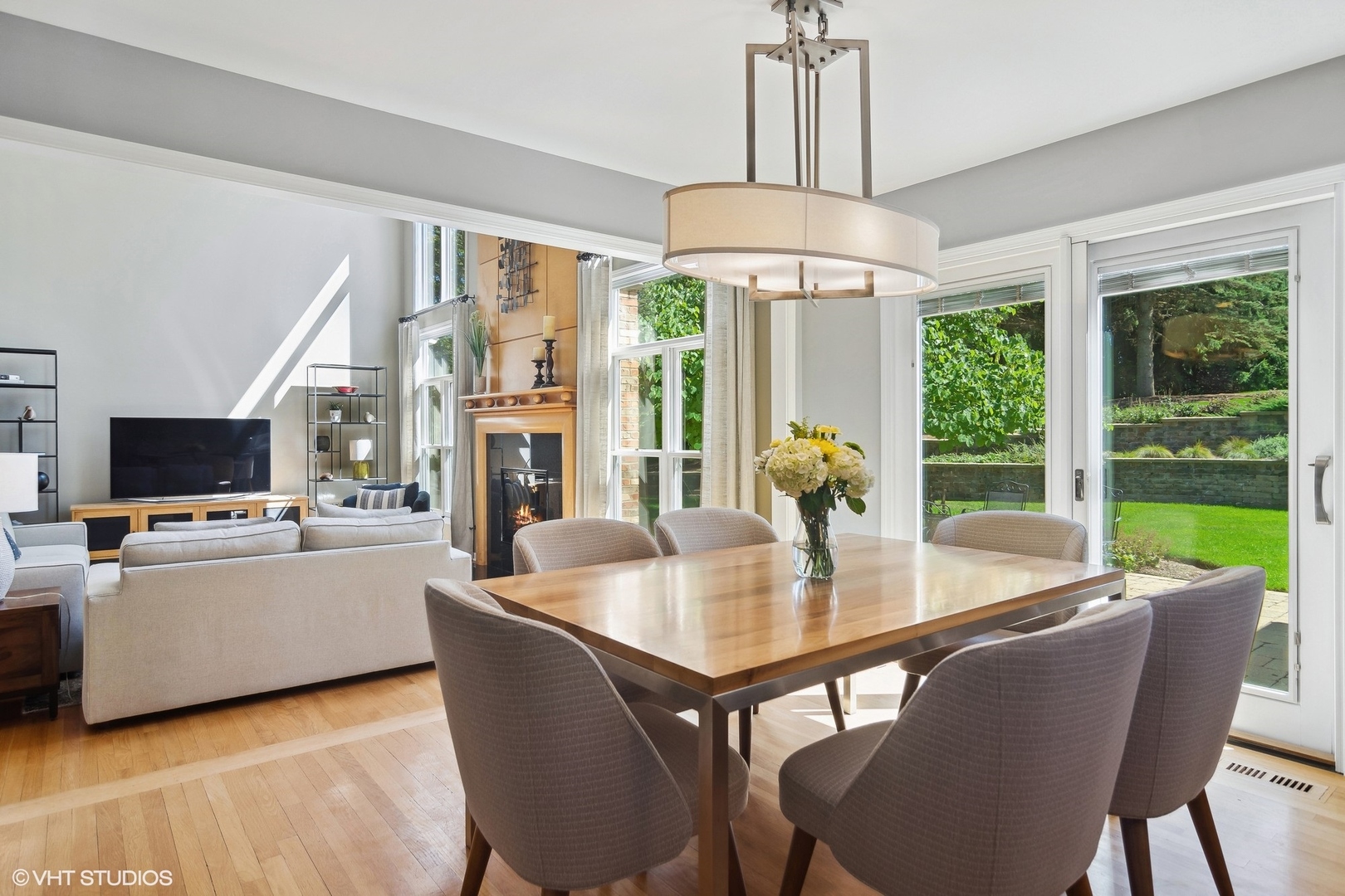 716 Saddle Ridge Crystal Lake, IL 60012 - Photo 13 of 42 a dining room with furniture a chandelier and wooden floor