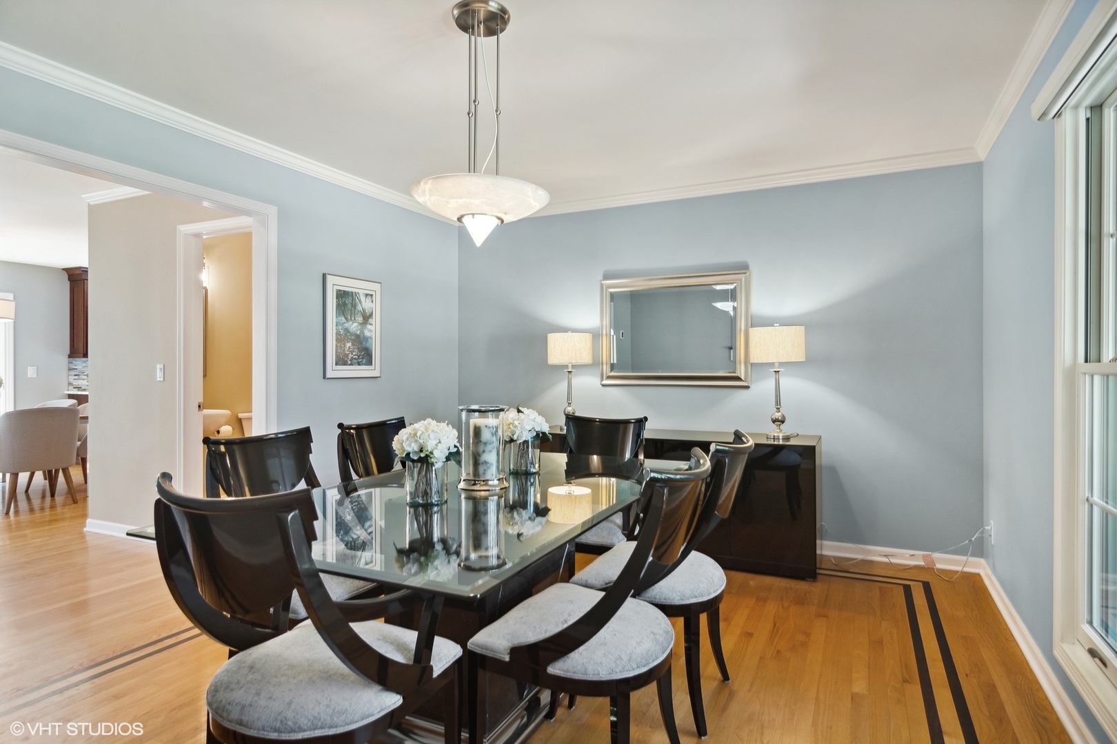 716 Saddle Ridge Crystal Lake, IL 60012 - Photo 16 of 42 a view of a dining room with furniture and wooden floor