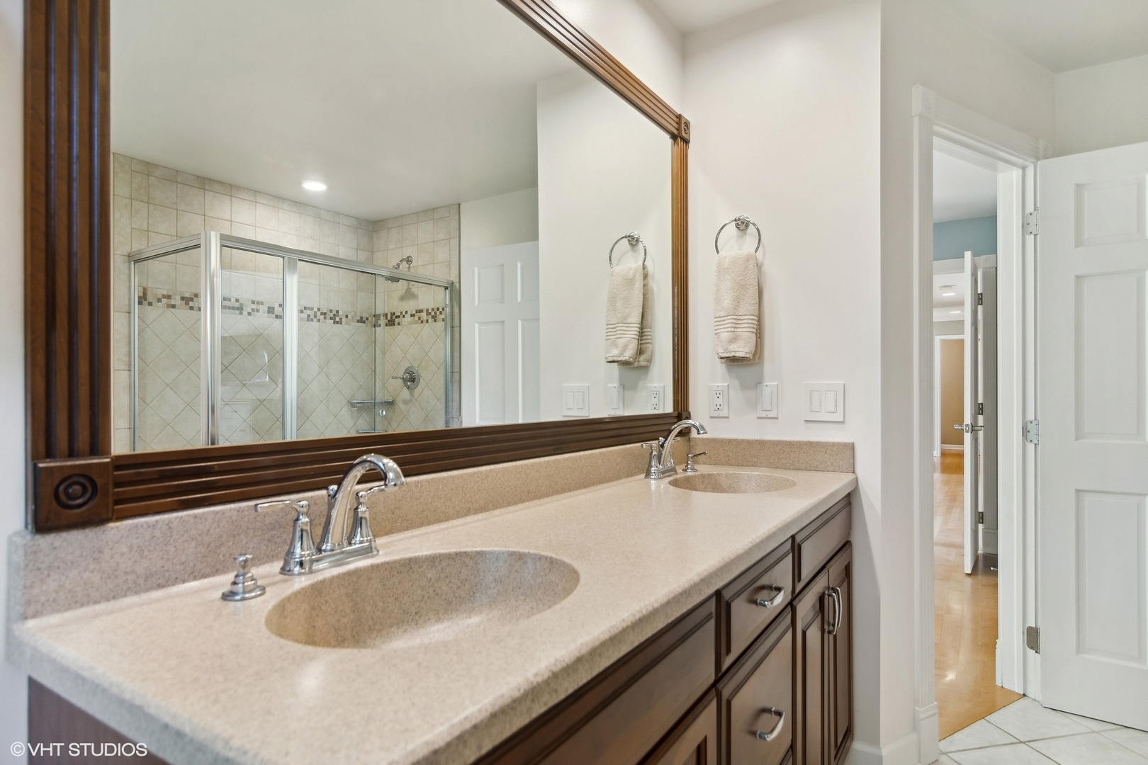 716 Saddle Ridge Crystal Lake, IL 60012 - Photo 19 of 42 a bathroom with double vanity sinks and a mirror