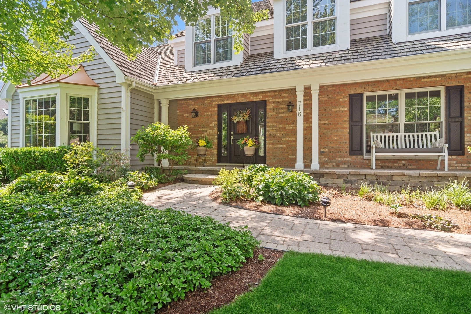 716 Saddle Ridge Crystal Lake, IL 60012 - Photo 2 of 42 front view of a house with a yard