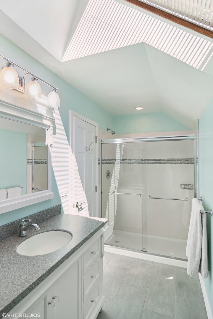 716 Saddle Ridge Crystal Lake, IL 60012 - Photo 25 of 42 a bathroom with a granite countertop sink and a mirror