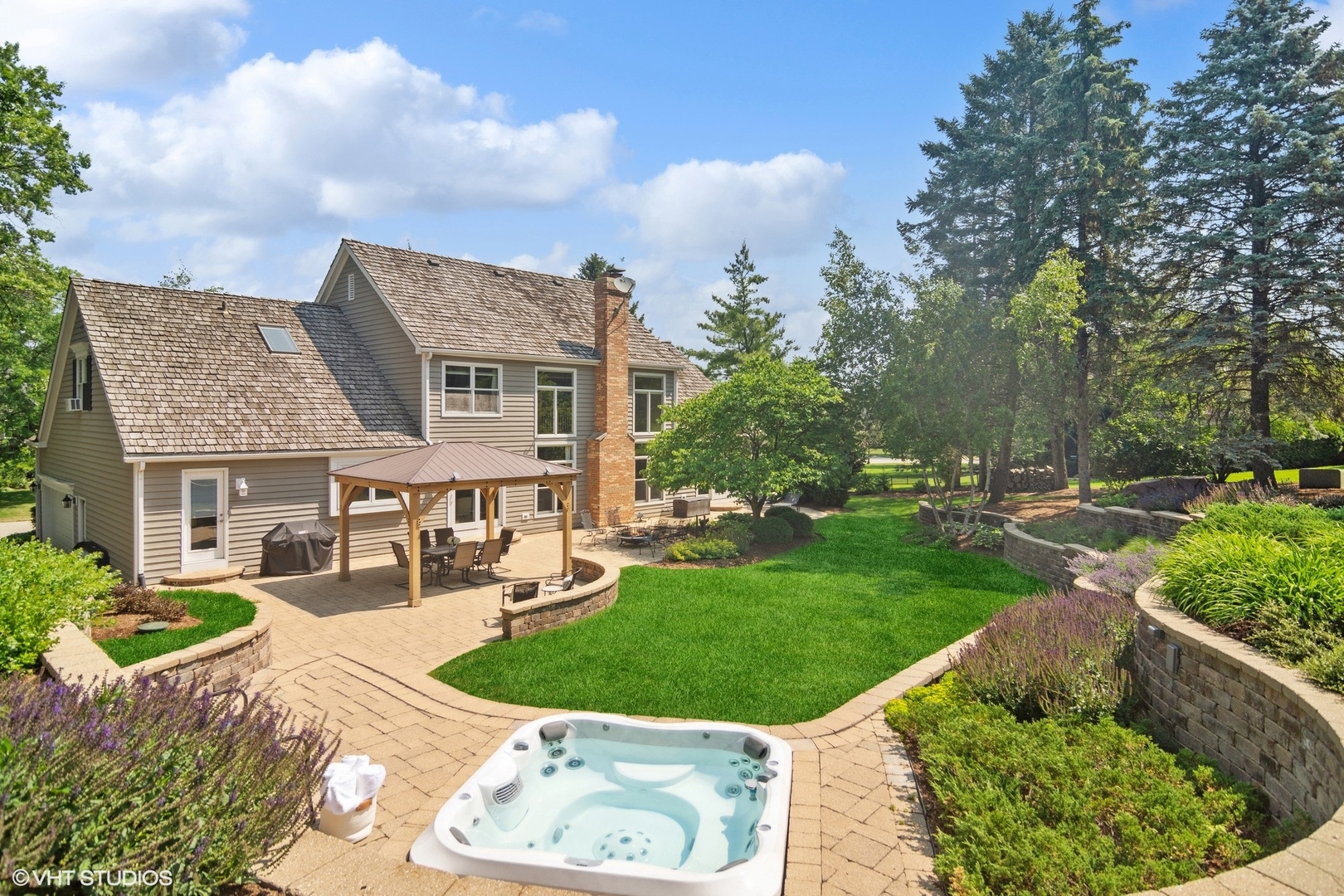 716 Saddle Ridge Crystal Lake, IL 60012 - Photo 26 of 42 a front view of a house with garden